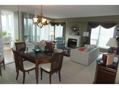 1004-237 King Street W, Cambridge, ON - Indoor Photo Showing Dining Room With Fireplace