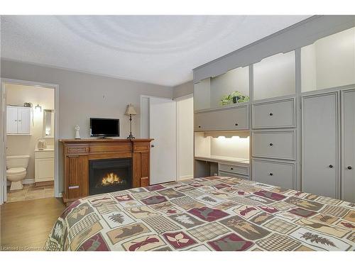 715362 Oxford Rd 4, Woodstock, ON - Indoor Photo Showing Bedroom With Fireplace