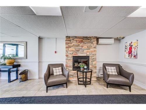 606-64 Benton Street, Kitchener, ON - Indoor Photo Showing Living Room With Fireplace