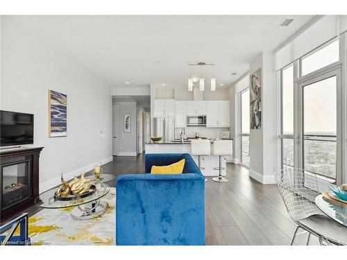 8-60 Charles Street W, Kitchener, ON - Indoor Photo Showing Living Room With Fireplace