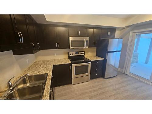 1B-1180 Countrystone Drive, Kitchener, ON - Indoor Photo Showing Kitchen With Stainless Steel Kitchen With Double Sink