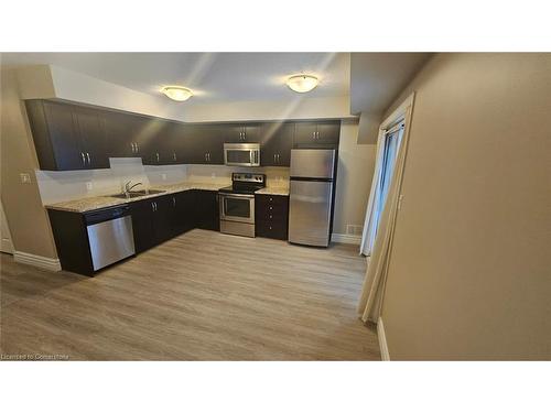 1B-1180 Countrystone Drive, Kitchener, ON - Indoor Photo Showing Kitchen With Stainless Steel Kitchen With Double Sink