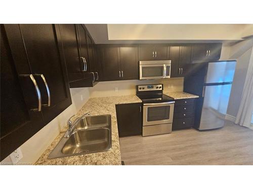 1B-1180 Countrystone Drive, Kitchener, ON - Indoor Photo Showing Kitchen With Stainless Steel Kitchen With Double Sink