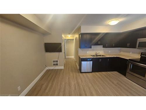 1B-1180 Countrystone Drive, Kitchener, ON - Indoor Photo Showing Kitchen With Double Sink