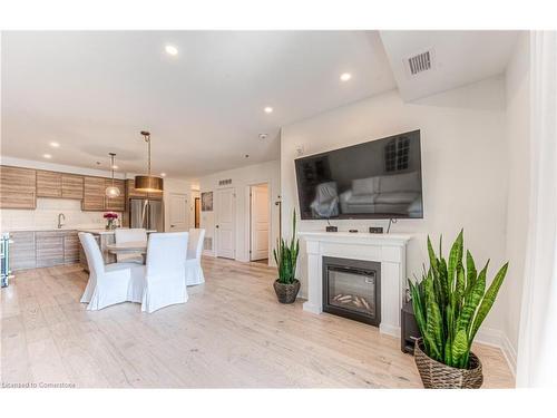 108-249 Grey Silo Road, Waterloo, ON - Indoor Photo Showing Living Room With Fireplace