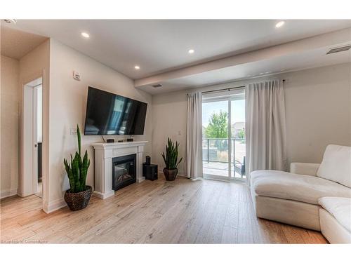 108-249 Grey Silo Road, Waterloo, ON - Indoor Photo Showing Living Room With Fireplace