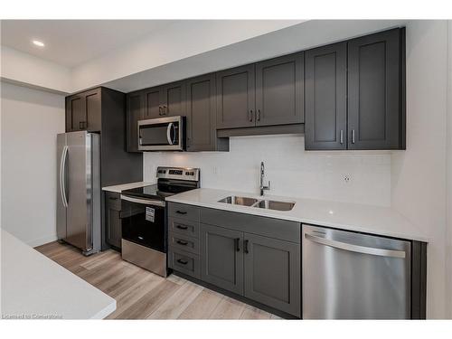 D73-405 Myers Road, Cambridge, ON - Indoor Photo Showing Kitchen With Double Sink