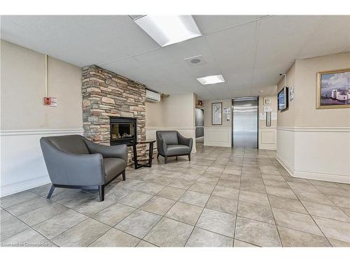 303-64 Benton Street, Kitchener, ON - Indoor Photo Showing Other Room With Fireplace