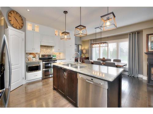 126 Robert Simone Way, Ayr, ON - Indoor Photo Showing Kitchen With Fireplace With Double Sink With Upgraded Kitchen