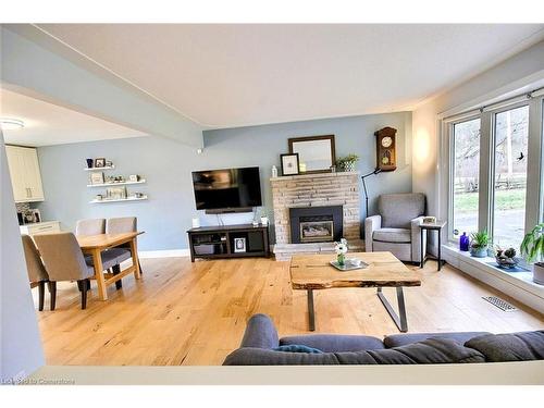 1413 West River Road, North Dumfries, ON - Indoor Photo Showing Living Room With Fireplace