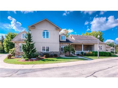 11D-350 Doon Valley Drive, Kitchener, ON - Outdoor With Facade