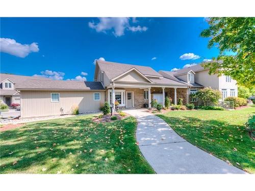 11D-350 Doon Valley Drive, Kitchener, ON - Outdoor With Deck Patio Veranda With Facade