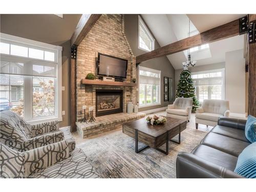 11D-350 Doon Valley Drive, Kitchener, ON - Indoor Photo Showing Living Room With Fireplace