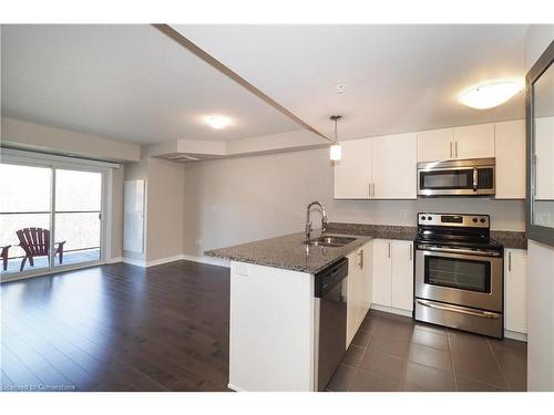 407-50 Bryan Court, Kitchener, ON - Indoor Photo Showing Kitchen With Stainless Steel Kitchen With Double Sink