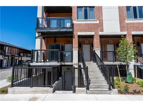 128-25 Isherwood Avenue, Cambridge, ON - Outdoor With Balcony With Facade