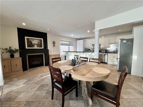 488 Timbercroft Crescent, Waterloo, ON - Indoor Photo Showing Dining Room With Fireplace