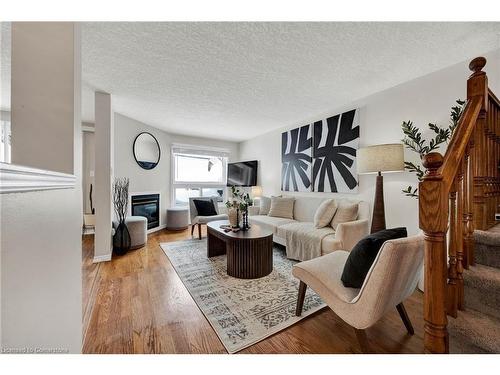 98 Bush Clover Crescent, Kitchener, ON - Indoor Photo Showing Living Room With Fireplace