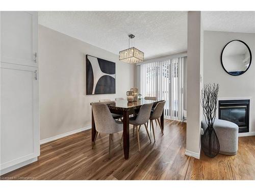 98 Bush Clover Crescent, Kitchener, ON - Indoor Photo Showing Dining Room With Fireplace