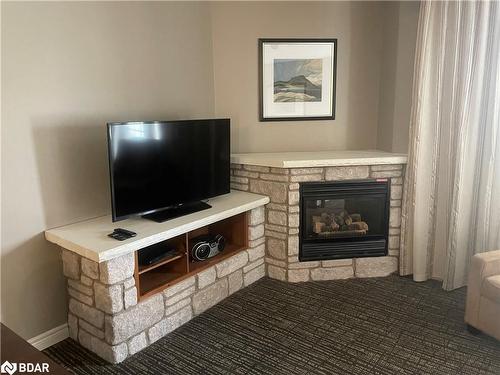 2430-31-90 Highland Drive, Oro-Medonte, ON - Indoor Photo Showing Living Room With Fireplace