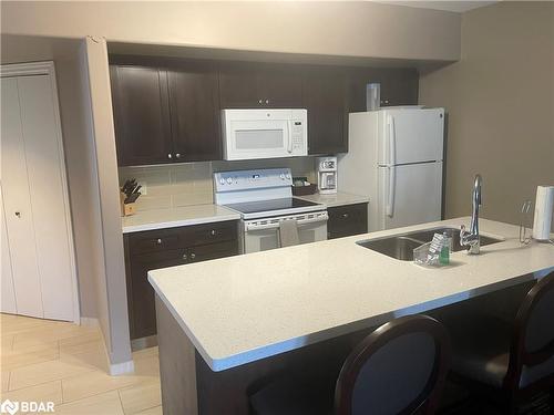 2430-31-90 Highland Drive, Oro-Medonte, ON - Indoor Photo Showing Kitchen With Double Sink