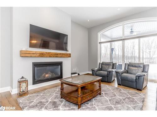 4428 North Valley Lane, Severn, ON - Indoor Photo Showing Living Room With Fireplace