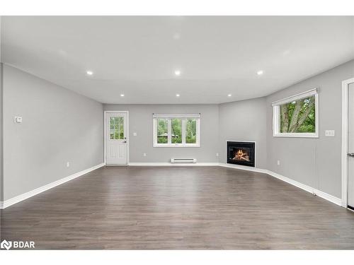 3554 John Street, Ramara, ON - Indoor Photo Showing Living Room With Fireplace