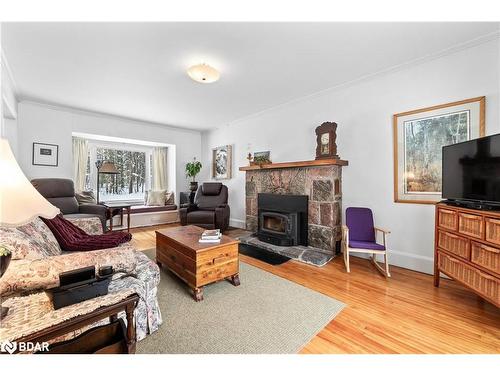 1111 Clipsham Road, Kilworthy, ON - Indoor Photo Showing Living Room With Fireplace