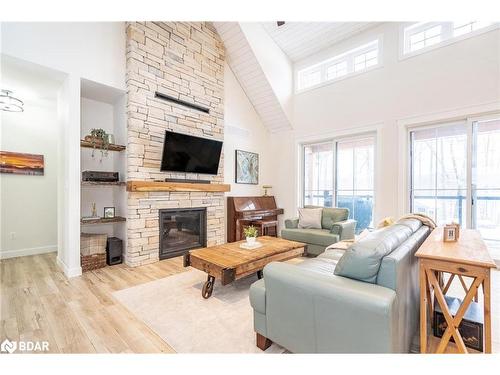 32 Leisure Court, Coldwater, ON - Indoor Photo Showing Living Room With Fireplace