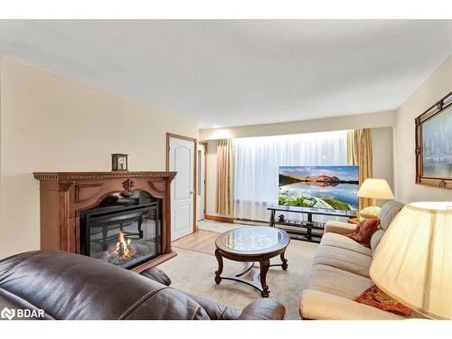 9 Riverside Crescent, Wasaga Beach, ON - Indoor Photo Showing Living Room With Fireplace