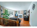65 Meadow Heights Drive, Bracebridge, ON  - Indoor Photo Showing Living Room With Fireplace 