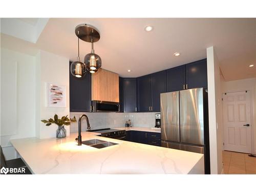 705-6 Toronto Street, Barrie, ON - Indoor Photo Showing Kitchen With Double Sink