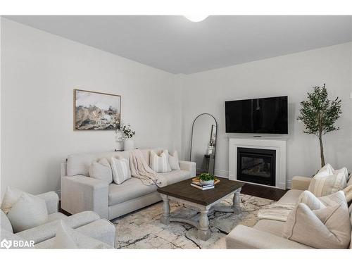 53 Sanford Circle, Springwater, ON - Indoor Photo Showing Living Room With Fireplace