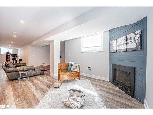 12 Reid'S Ridge, Moonstone, ON - Indoor Photo Showing Living Room With Fireplace