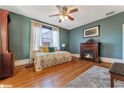 3 North Street, Colborne, ON - Indoor Photo Showing Bedroom With Fireplace