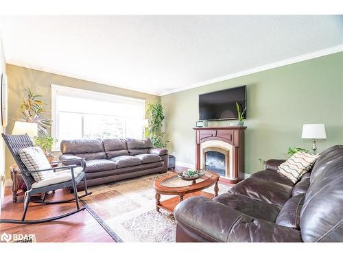 8570 8Th Line Line, Essa, ON - Indoor Photo Showing Living Room With Fireplace