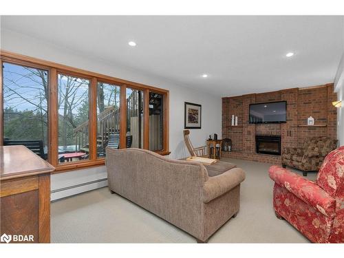 9 Doran Road, Springwater, ON - Indoor Photo Showing Living Room With Fireplace