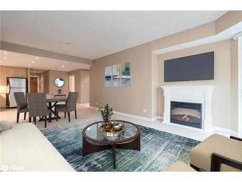 907-33 Ellen Street, Barrie, ON - Indoor Photo Showing Living Room With Fireplace