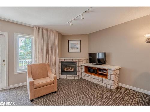 2220-2221-90 Highland Drive, Oro-Medonte, ON - Indoor Photo Showing Living Room With Fireplace