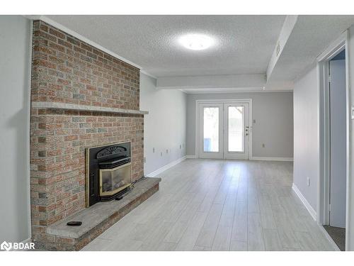 15 Lankin Boulevard, Orillia, ON - Indoor Photo Showing Living Room With Fireplace