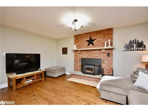 15 George Street, Oro-Medonte, ON - Indoor Photo Showing Living Room With Fireplace
