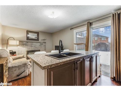 27 Virgilwood Crescent, Barrie, ON - Indoor Photo Showing Kitchen With Fireplace With Double Sink