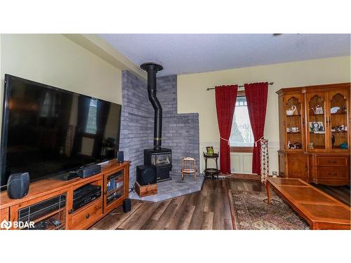 1743 Golf Course Road, Springwater, ON - Indoor With Fireplace
