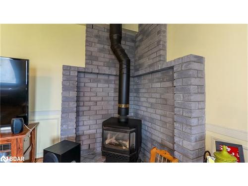 1743 Golf Course Road, Springwater, ON - Indoor With Fireplace