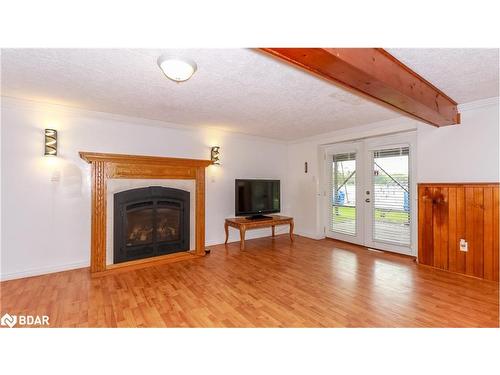 4001 Longford Mills Road, Ramara, ON - Indoor Photo Showing Living Room With Fireplace