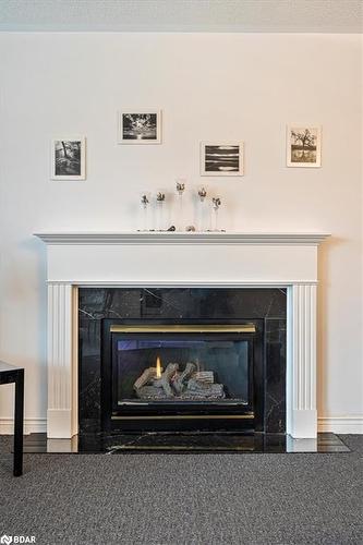 9 Lang Drive, Barrie, ON - Indoor Photo Showing Living Room With Fireplace