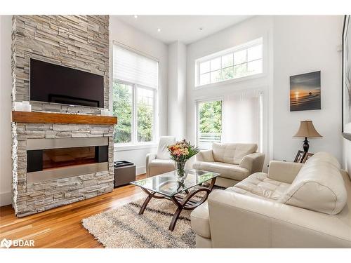 98 Savannah Crescent, Wasaga Beach, ON - Indoor Photo Showing Living Room With Fireplace