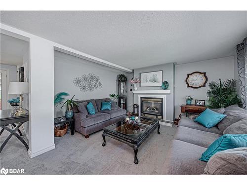 112 Linden Lane, Innisfil, ON - Indoor Photo Showing Living Room With Fireplace