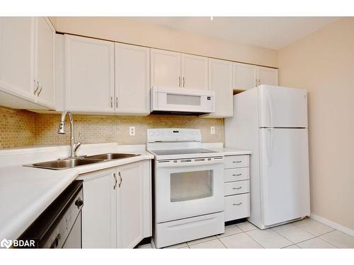 103-25 Meadow Lane, Barrie, ON - Indoor Photo Showing Kitchen With Double Sink