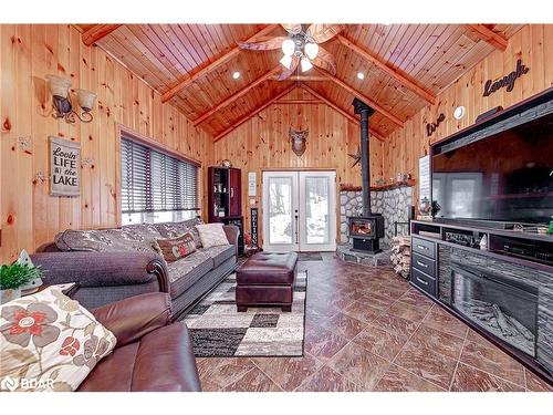 1160 North Kahshe Lake Road, Gravenhurst, ON - Indoor Photo Showing Living Room With Fireplace
