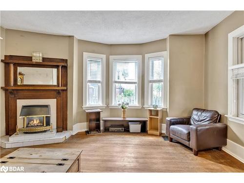 212 Aylmer Street N, Peterborough, ON - Indoor Photo Showing Living Room With Fireplace